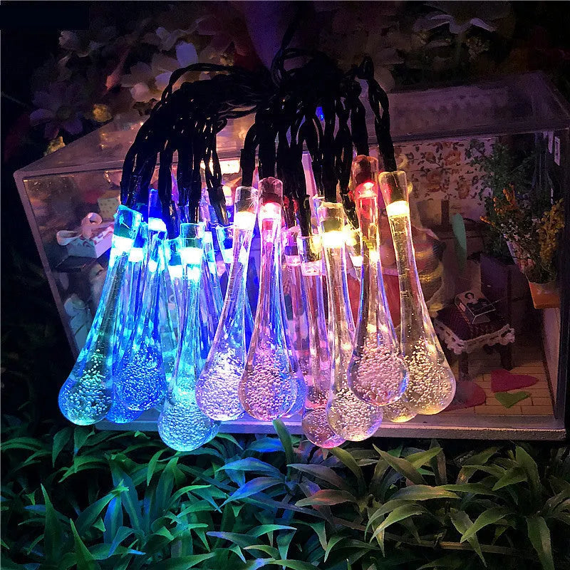Solar-powered outdoor string lights with water drop shaped pendants on a 6.5 metre cable.