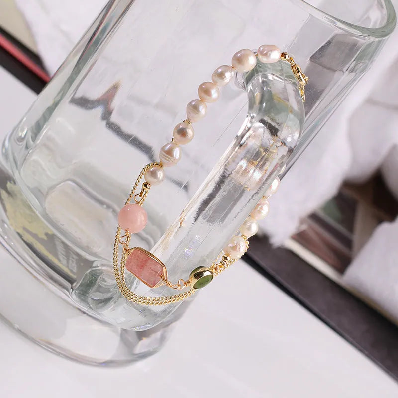 Women's freshwater pearl bracelet with geometric design and strawberry crystal charm in pink