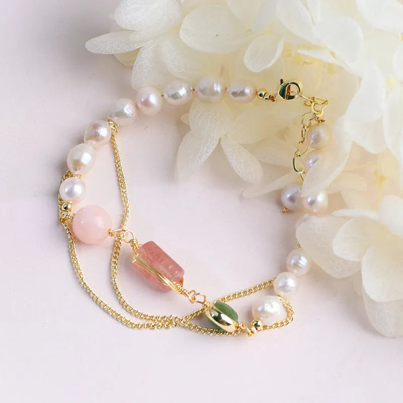 Women's freshwater pearl bracelet with geometric design and strawberry crystal charm in pink