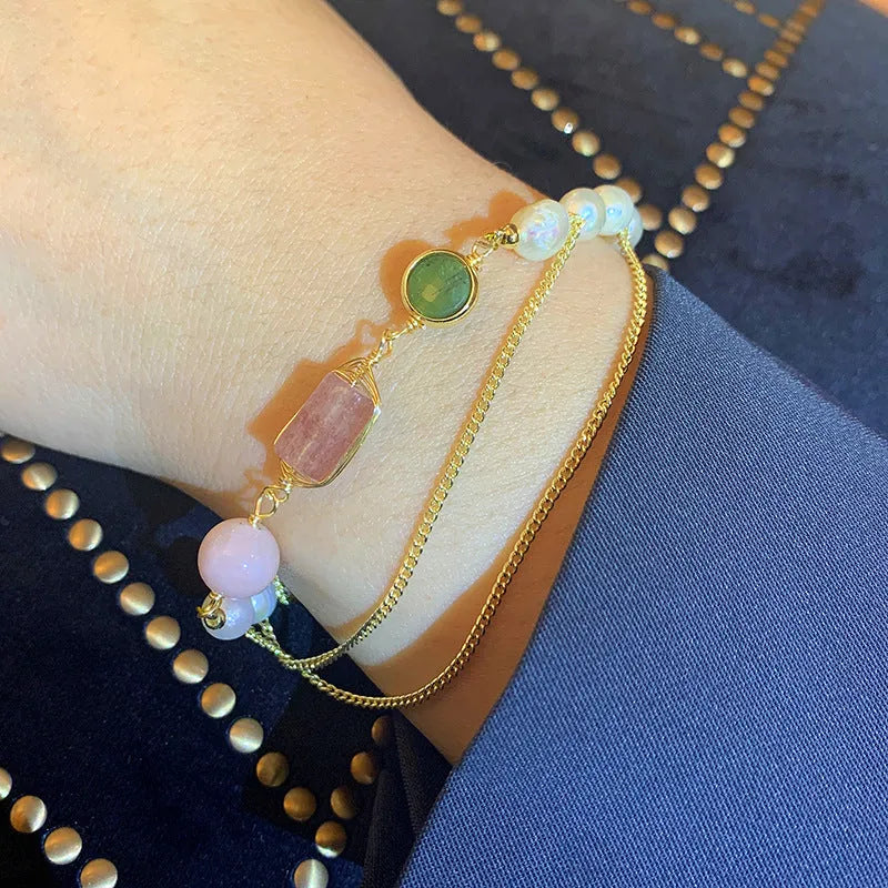 Women's freshwater pearl bracelet with geometric design and strawberry crystal charm in pink
