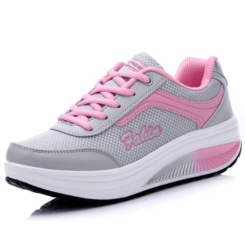 Women's heelless single shoes in grey powder with a mid heel, shown on a plain background.