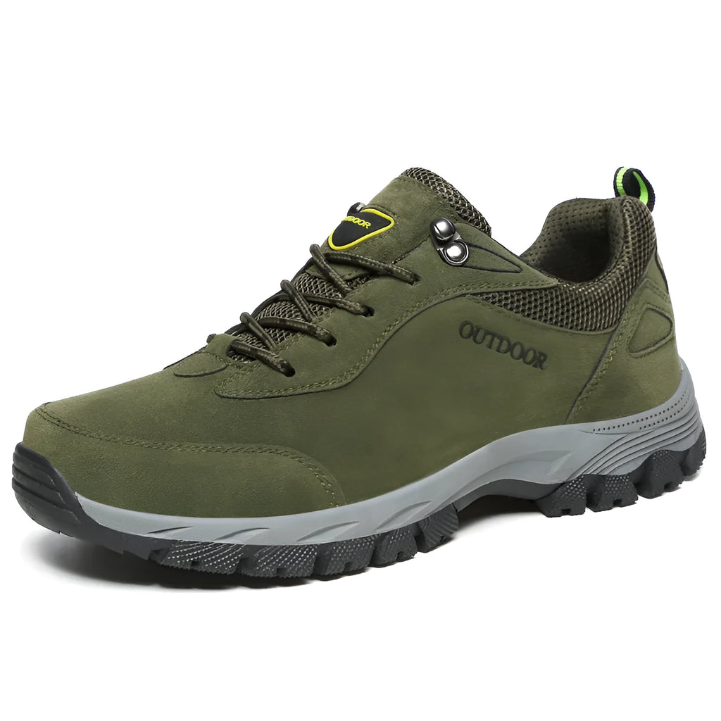 Men's low-top hiking shoe in army green with mesh upper on a natural surface