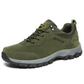 Men's low-top hiking shoe in army green with mesh upper on a natural surface