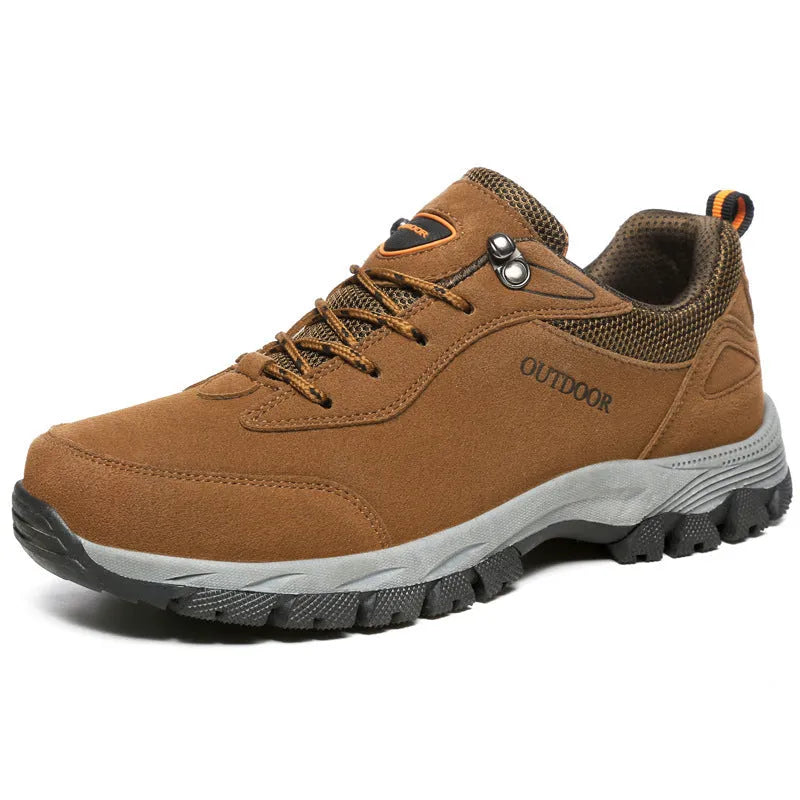 Men's low-top hiking shoe in army green with mesh upper on a natural surface