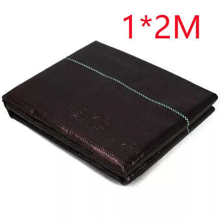 Black polyethylene composite woven weed control cloth for farmland and greenhouse use.