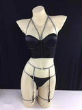 Three-point garter set in black polyester with bra, garter belt, and adjustable garters