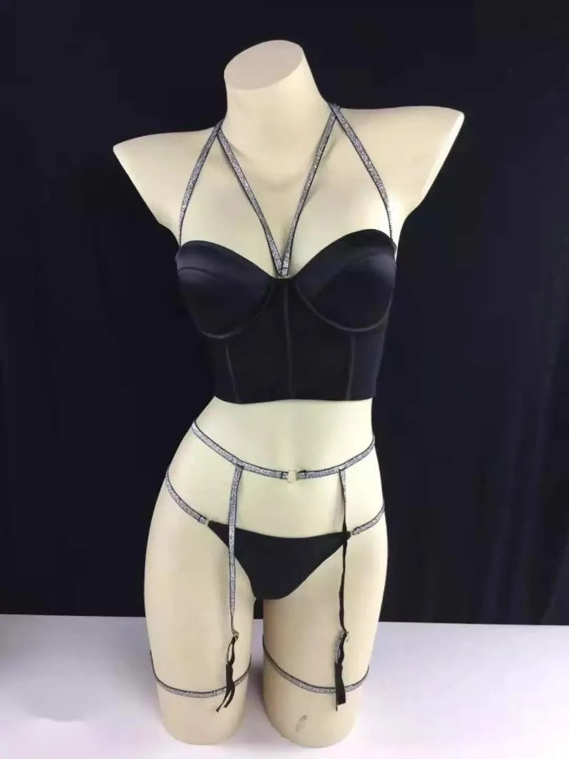 Three-point garter set in black polyester with bra, garter belt, and adjustable garters