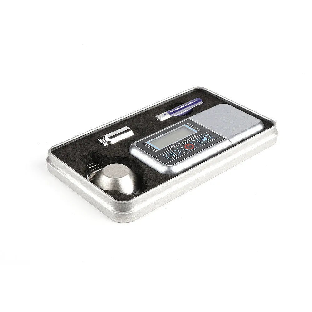 Digital electronic precision scale with 100g capacity and 0.005g accuracy on a flat surface.