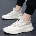 Men's white low-top mesh sports shoe with round toe and rubber sole on a plain background