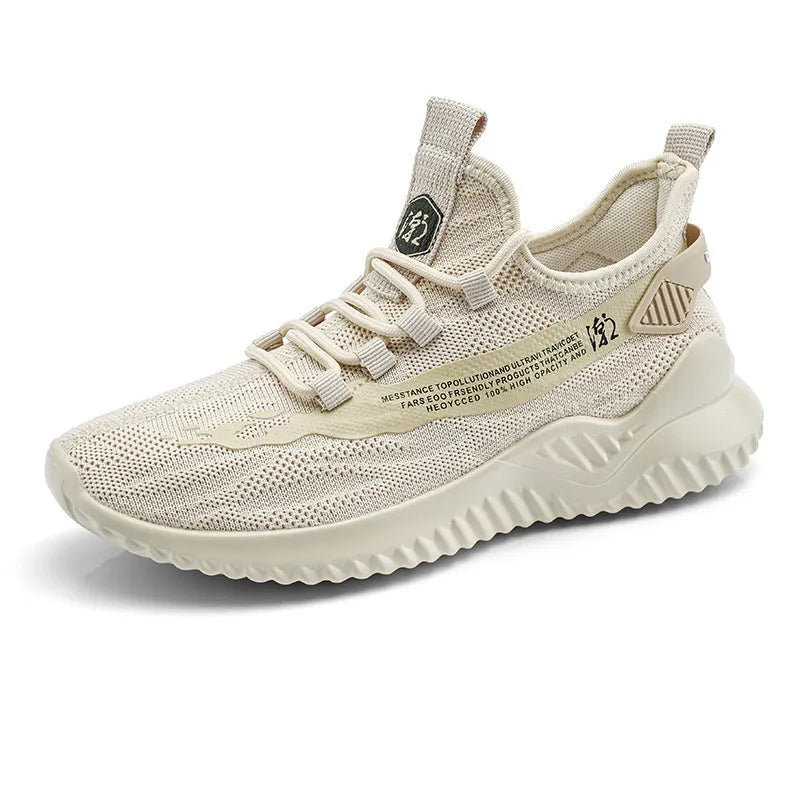 Men's white low-top mesh sports shoe with round toe and rubber sole on a plain background