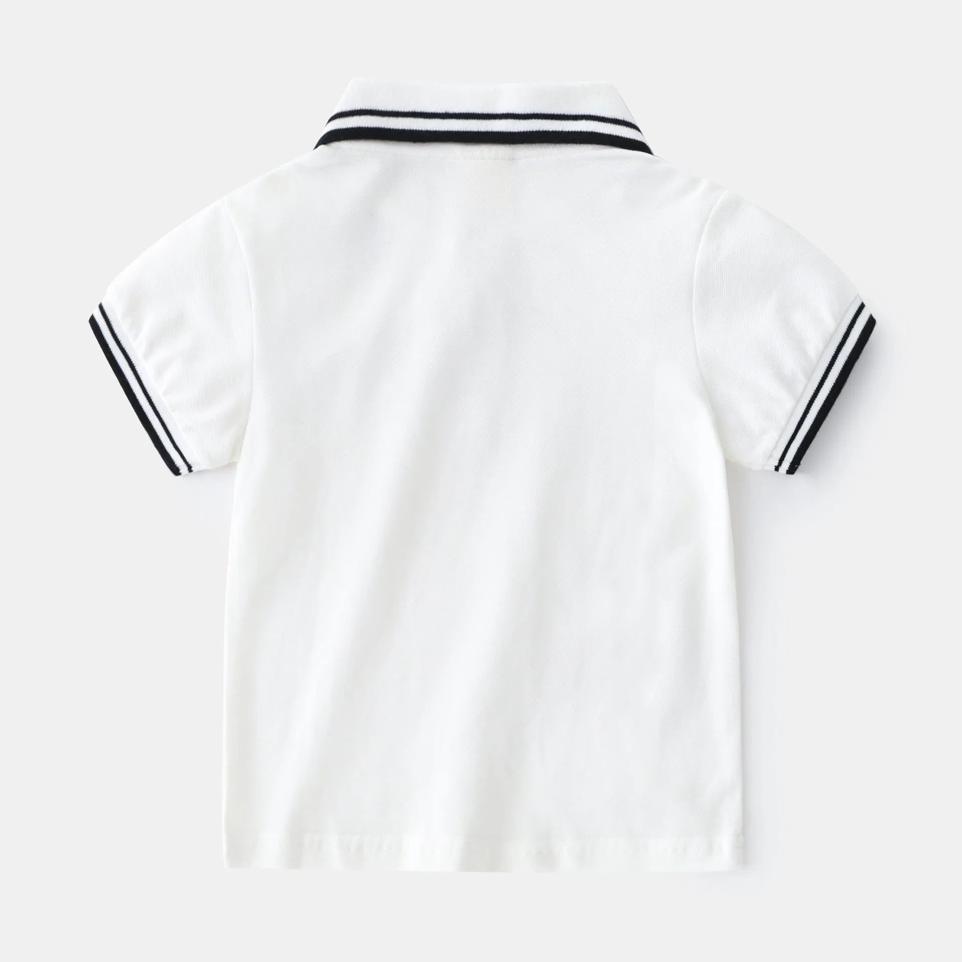 Boys' white and black cotton polo shirt with short sleeves and round neck collar