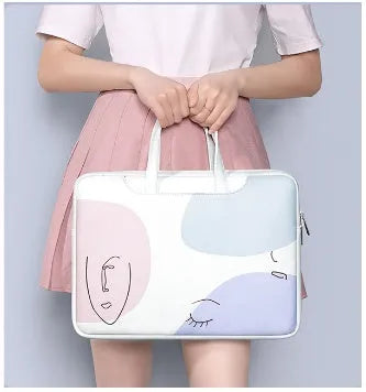 Blue PU leather laptop bag for a 15.6-inch notebook, showing the soft handle and zipper closure.