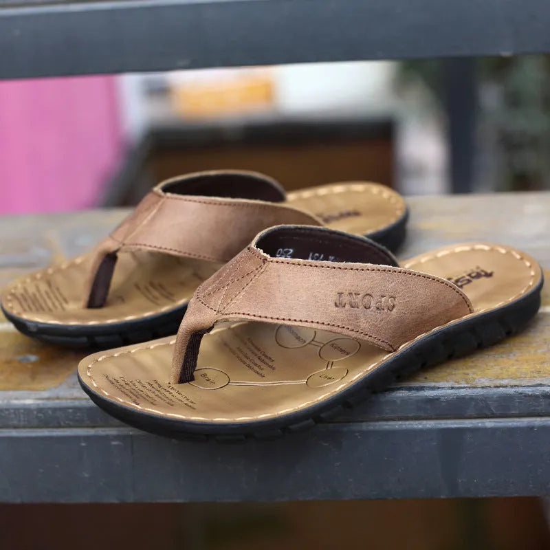 Men's cowhide leather flip-flops with open toe and rubber sole, shown in black, brown and khaki, sizes 38-44.