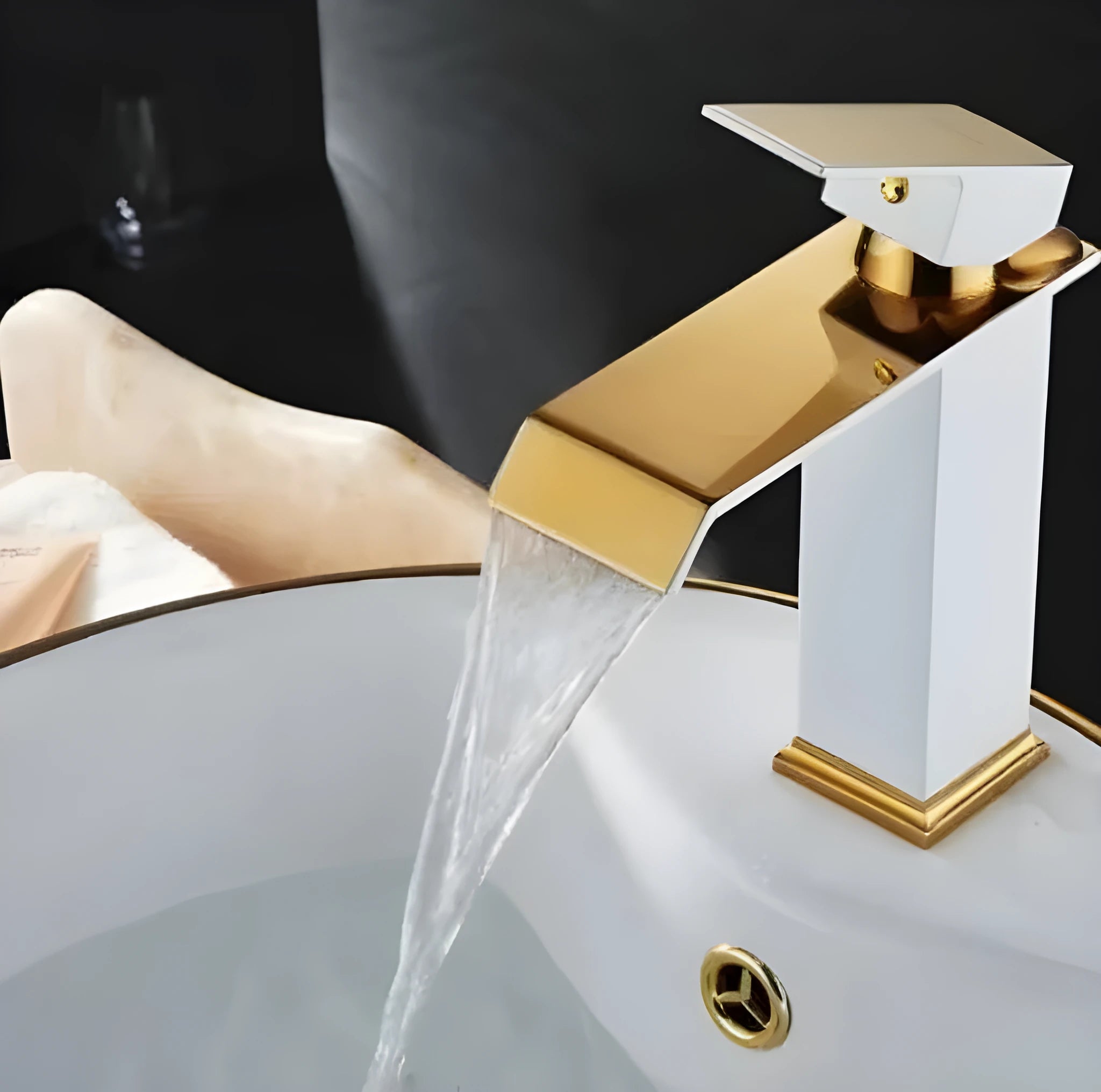 Copper waterfall basin faucet with blackened finish and gold accents in American art deco style