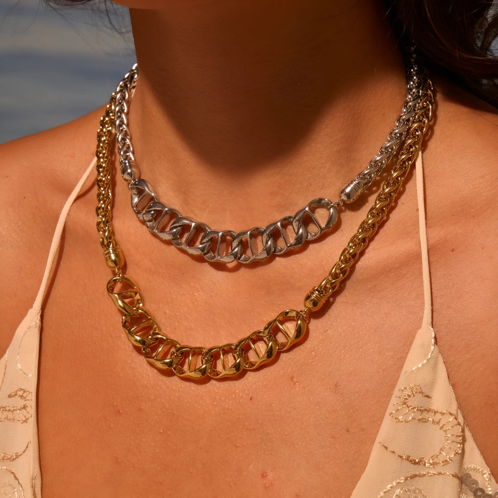 Stainless steel geometric chain necklace with 18K gold plating in gold or steel finish.