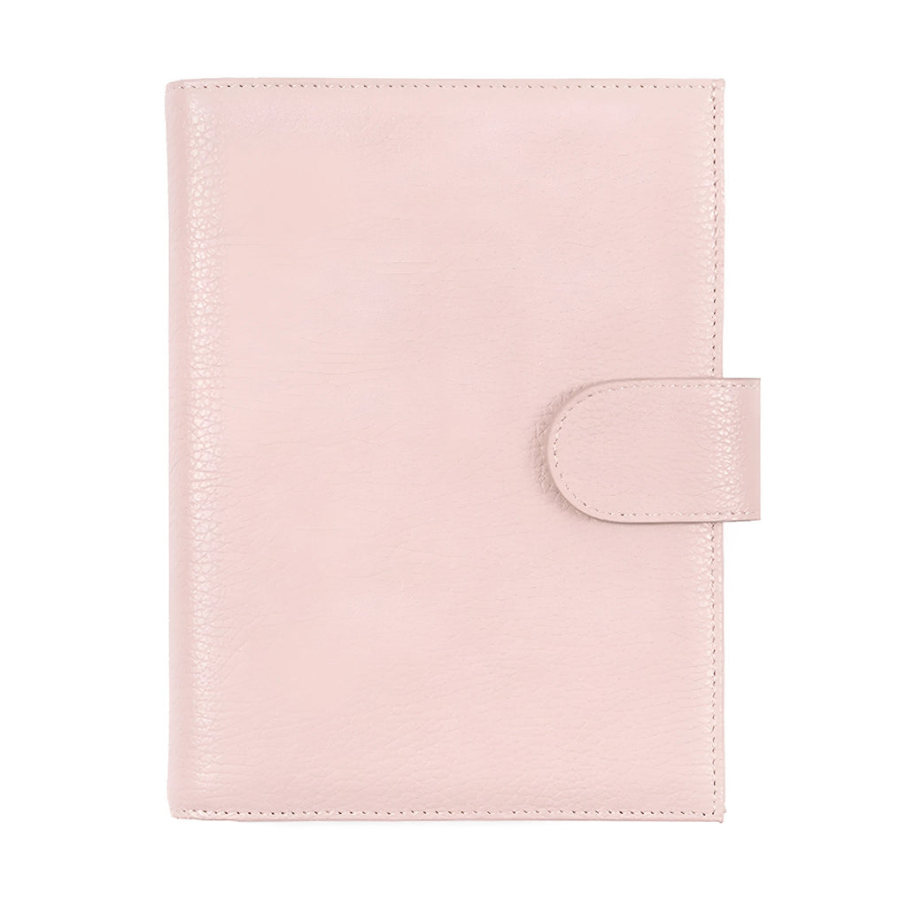 Close-up of a lychee pattern head layer cowhide A6 loose-leaf diary in off white, showing textured cover and ring binding