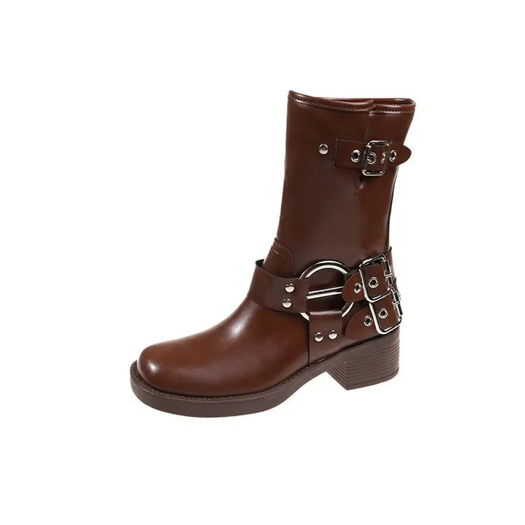 Women's black platform boots with belt buckle detail showing middle calf length