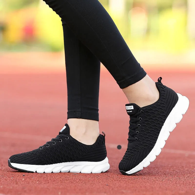 Women's running shoes with fly weaving upper in black, pink, and white colour options