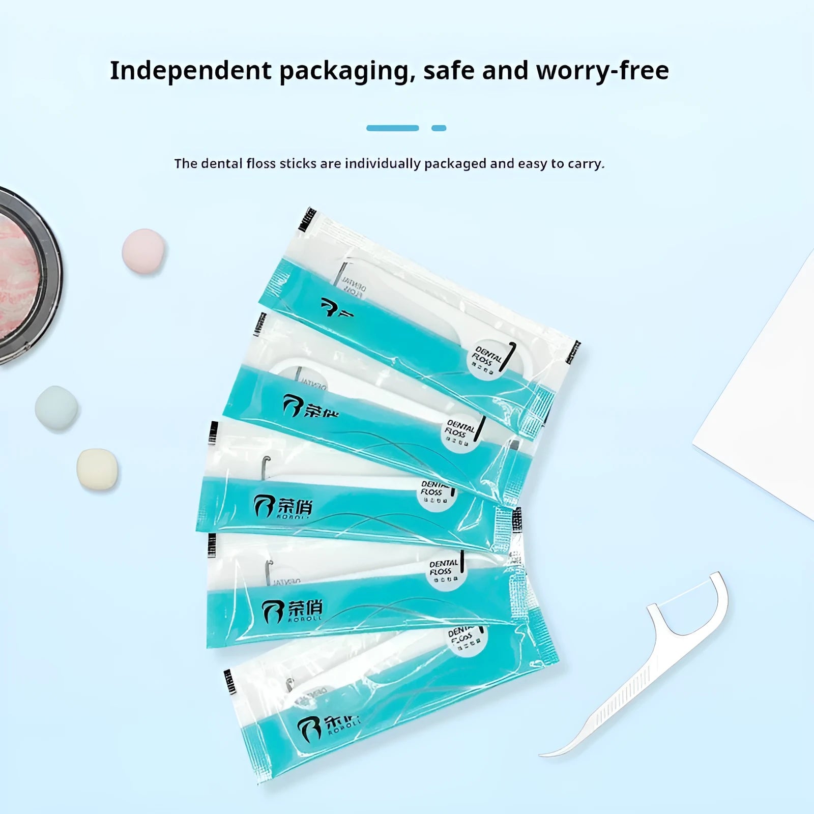 Plastic dental floss packets in a bag, showing independent packaging and 100/108 piece count options