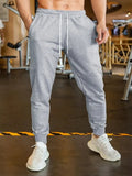 Men's loose-fit linen-style casual trousers with an elastic drawstring waist, shown in a neutral colour.