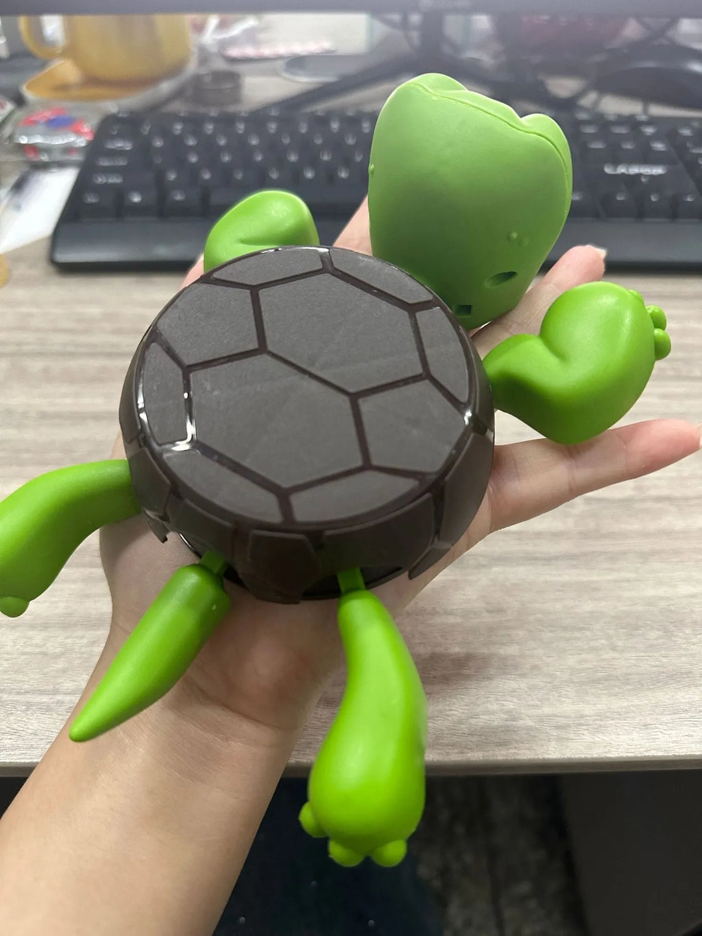 Turtle-shaped ABS plastic coaster in light green colour providing heat insulation for drinkware