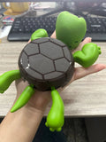 Turtle-shaped ABS plastic coaster in light green colour providing heat insulation for drinkware
