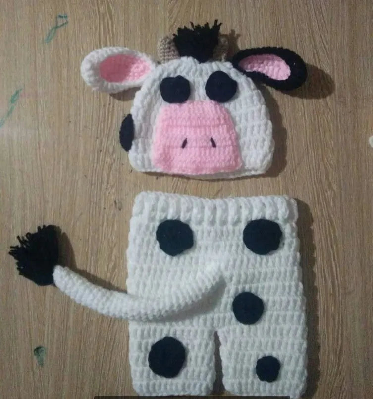 White hand knitted baby cow suit with hat and pants in wool and cotton