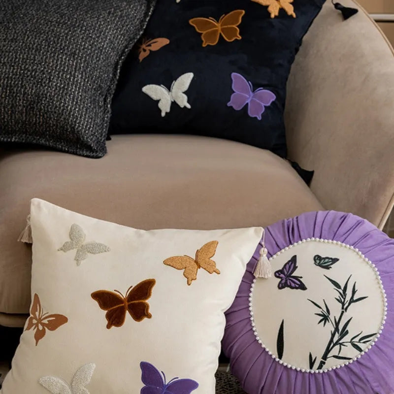 Square beige cushion with intricate Chinese style butterfly embroidery, 45cm in size.