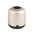 Hieha XQ11 cylinder-shaped portable Bluetooth speaker in silver colour on a table.