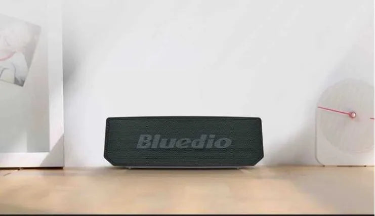Black BS-6 cloud smart speaker with compact rectangular design on a surface.