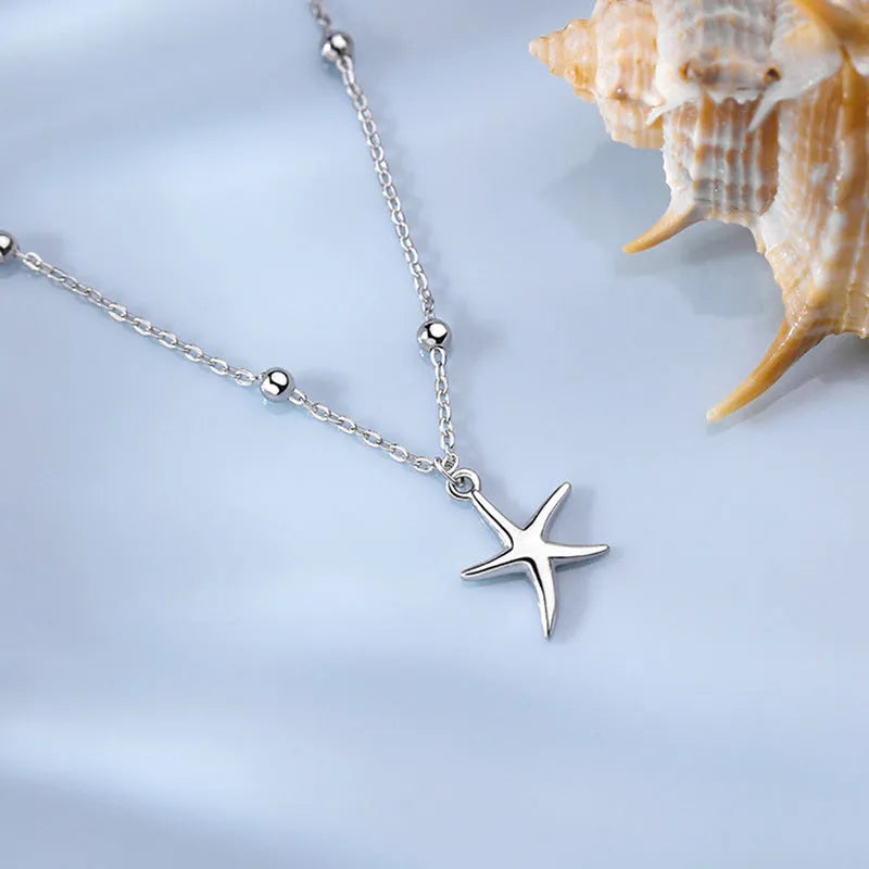Women's sterling silver anklet with a starfish charm on a round bead chain.