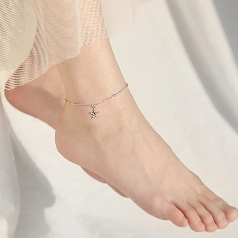 Women's sterling silver anklet with a starfish charm on a round bead chain.