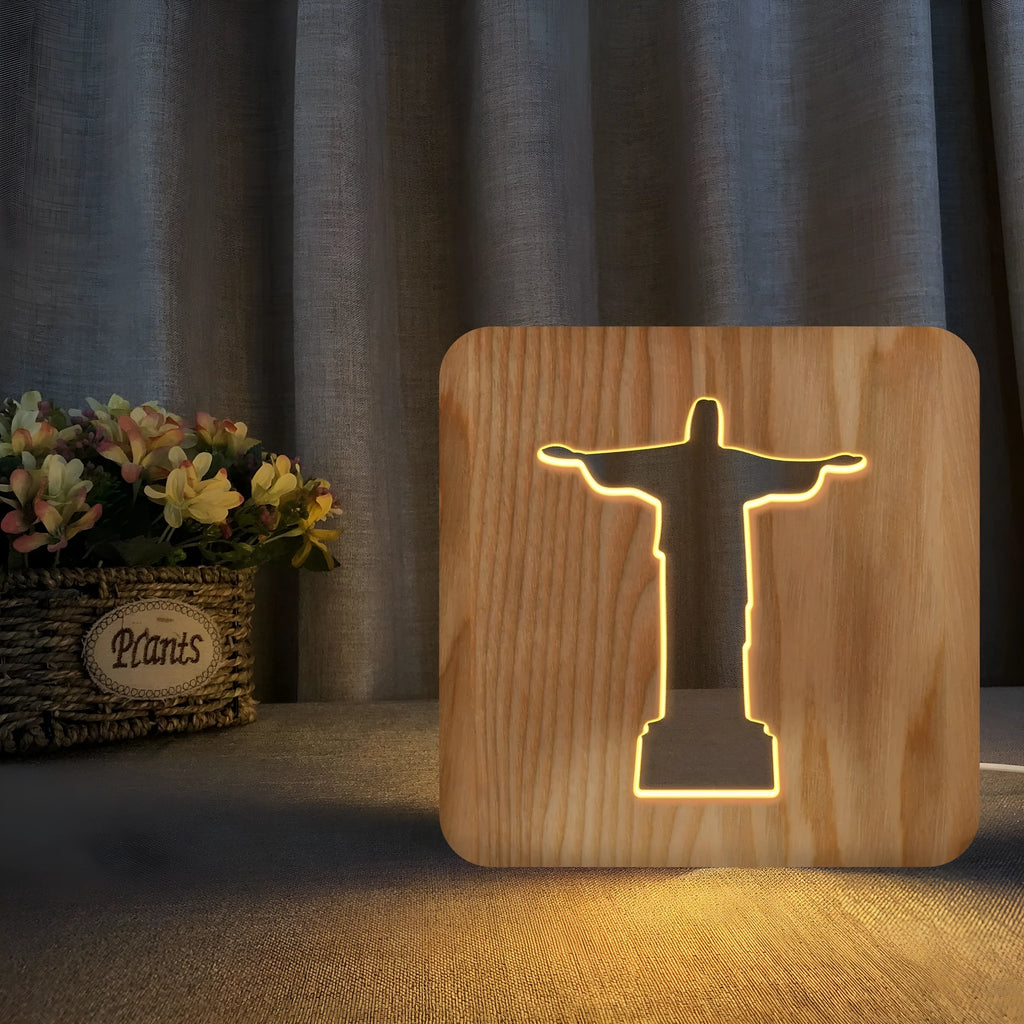 Solid wood hollow LED night lamp warm white with USB cable on wooden surface