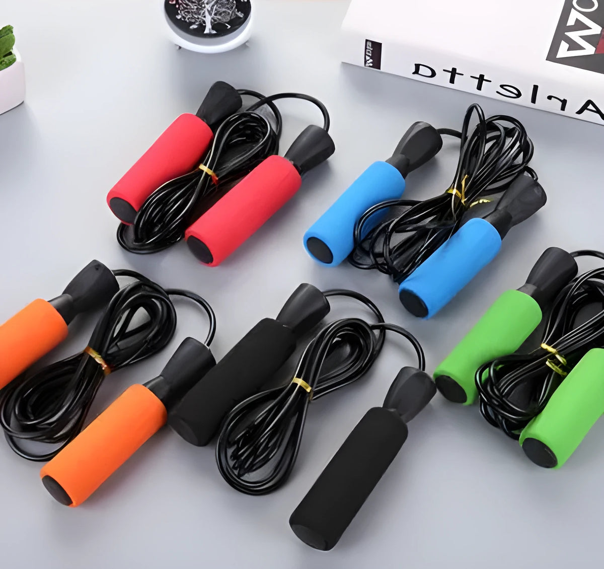 Sponge jump rope for student fitness, 2.5m long with 13.5cm handles, in orange, black, blue, green, or red.