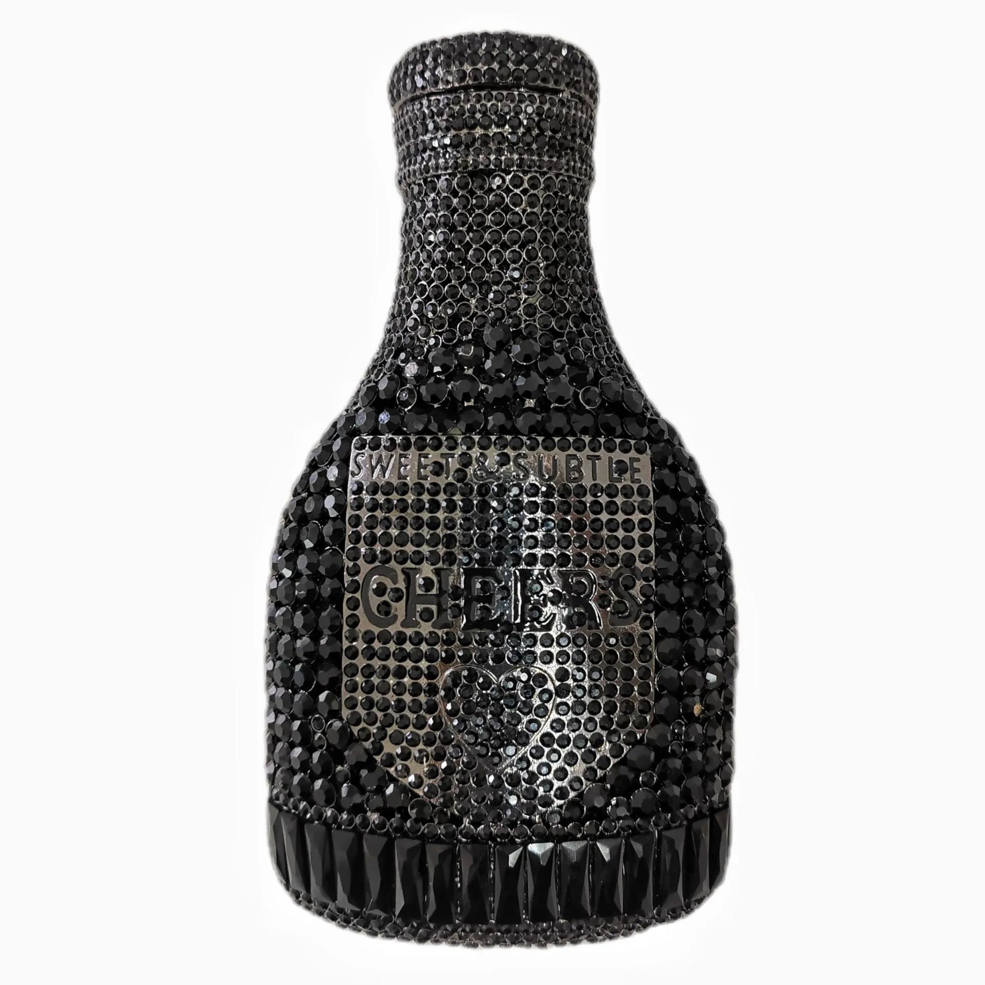 Gold champagne bottle shaped evening clutch with rhinestone decoration on black background