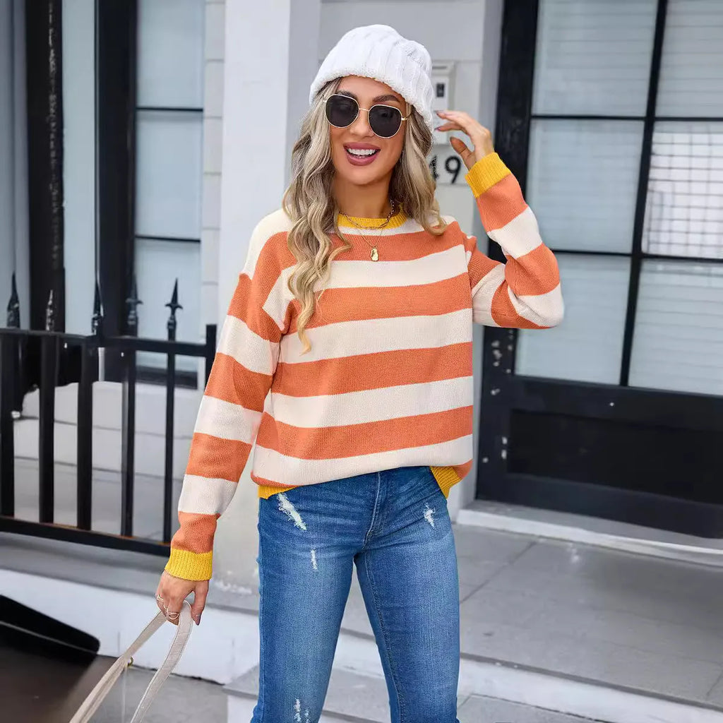 Women's loose fit long sleeve acrylic sweater in blue with a plaid pattern, featuring a round neck.