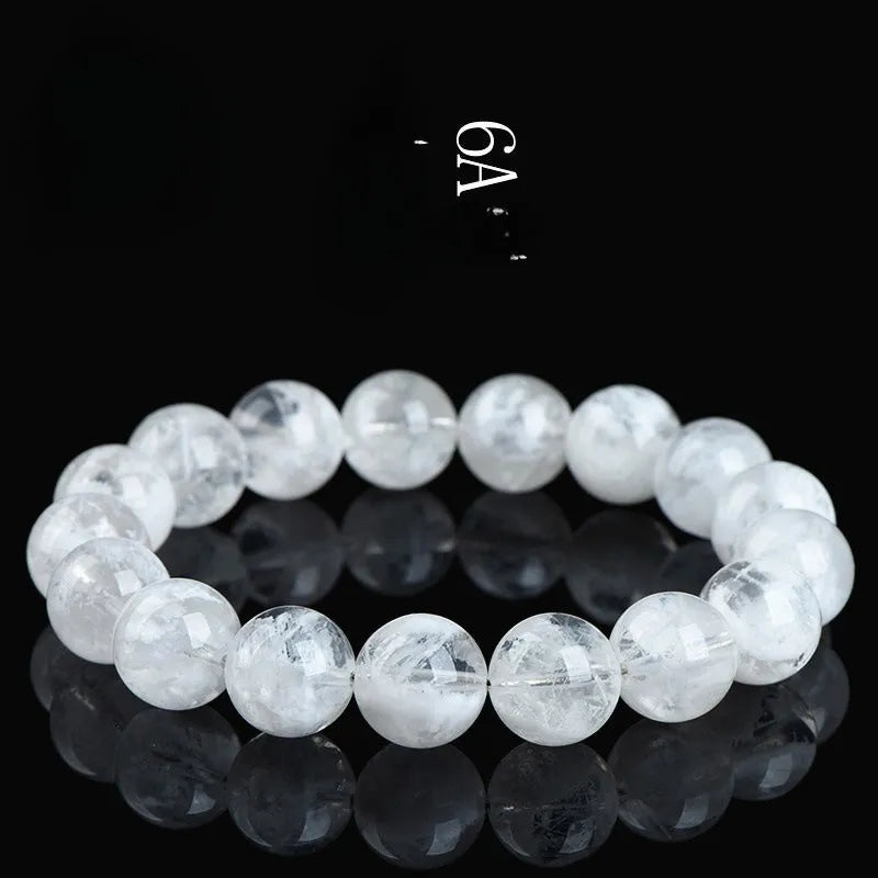Women's crystal bracelet with natural blizzard snowflake round beads and traditional charm elements