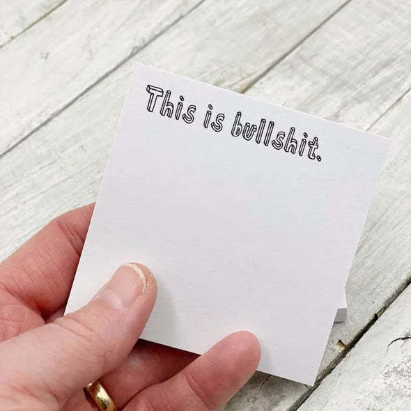 Square sticky note pad measuring 75mm with humorous covers and self-adhesive backing