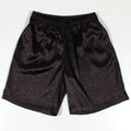 Men's black elastic waist Tang suit shorts for martial arts practice on a plain background