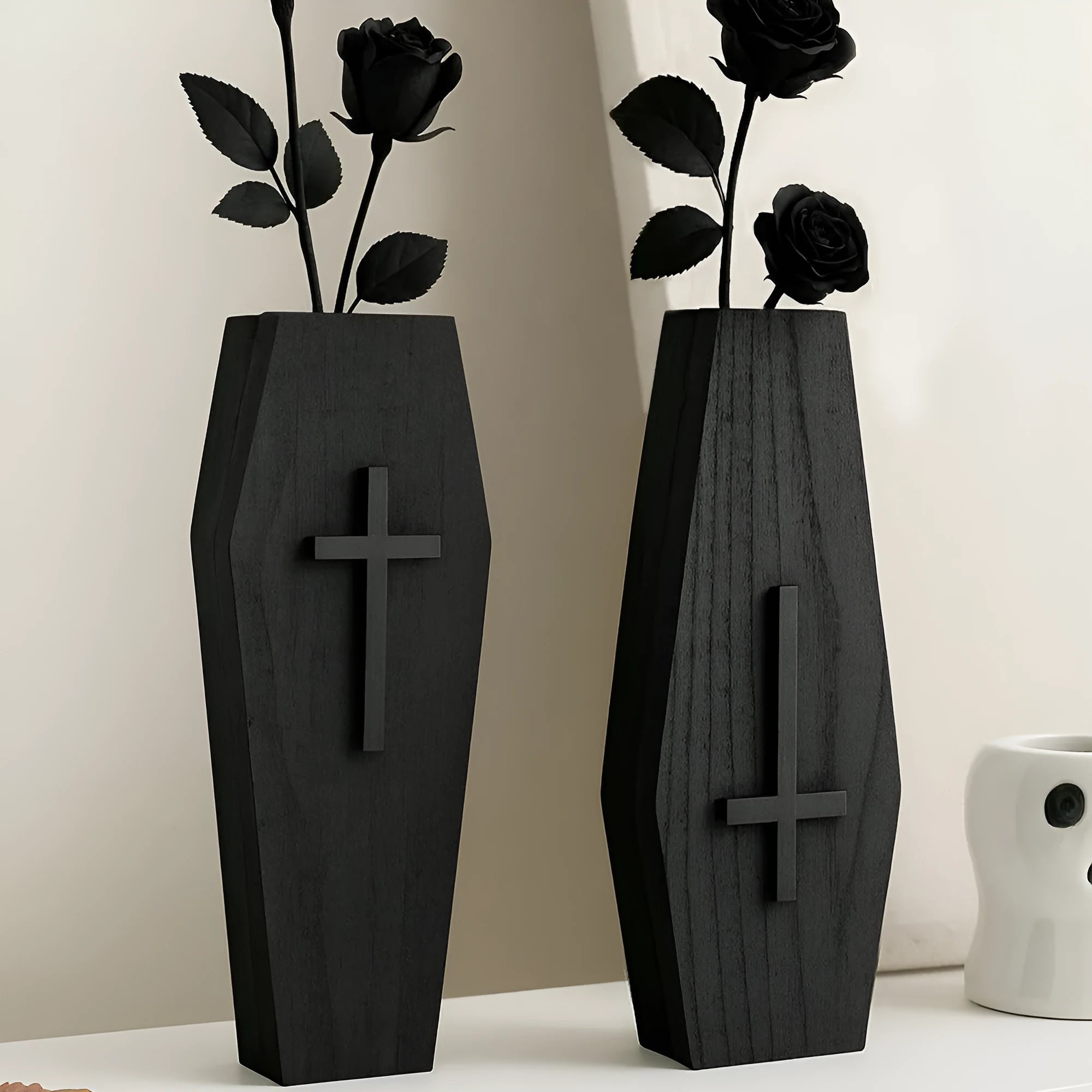Wooden cross-shaped wall shelf decoration in black colour measuring 27 cm wide