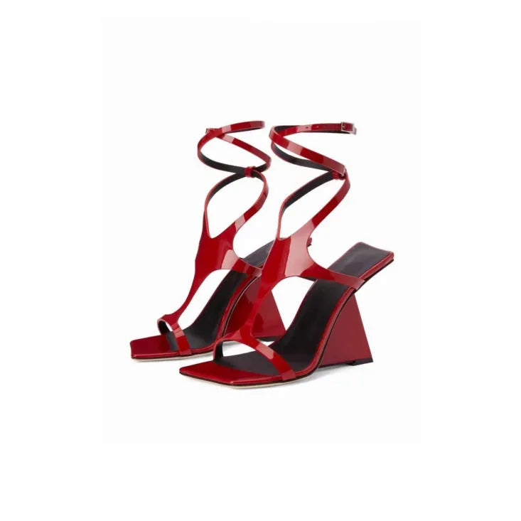 Women's black high heel sandals with 9.5cm wedge, square toe, and button fastening on a white background.