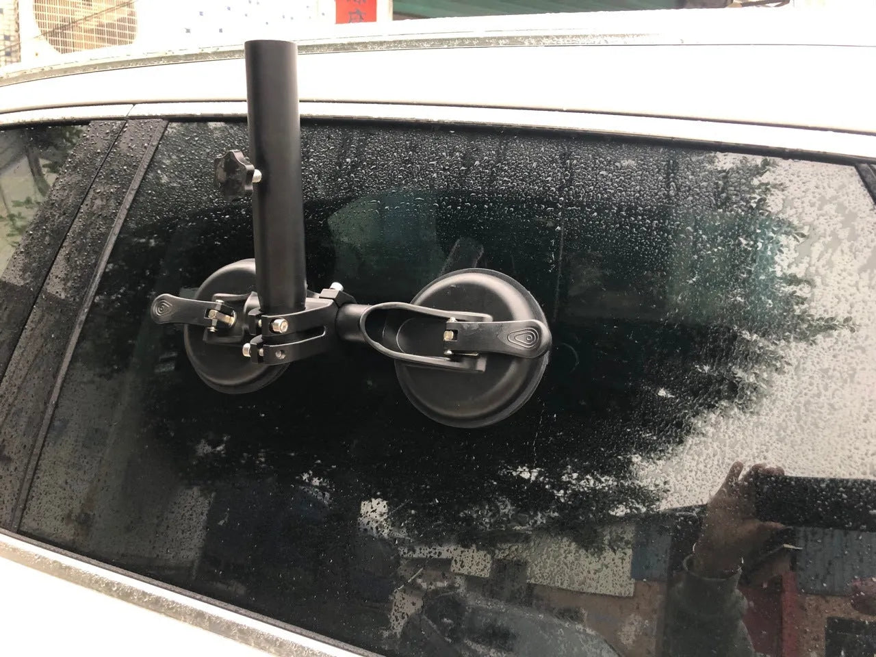 Black off-road car flagpole sucker base with round glass suction cup and rubber disc body.