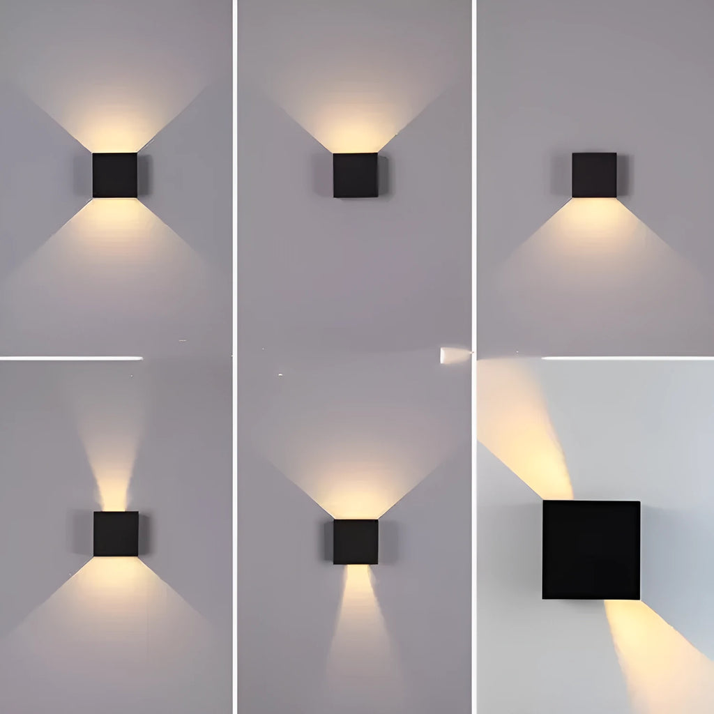 Black aluminium square wall lamp mounted on a corridor wall, showing 100mm size and 360-degree light emission.