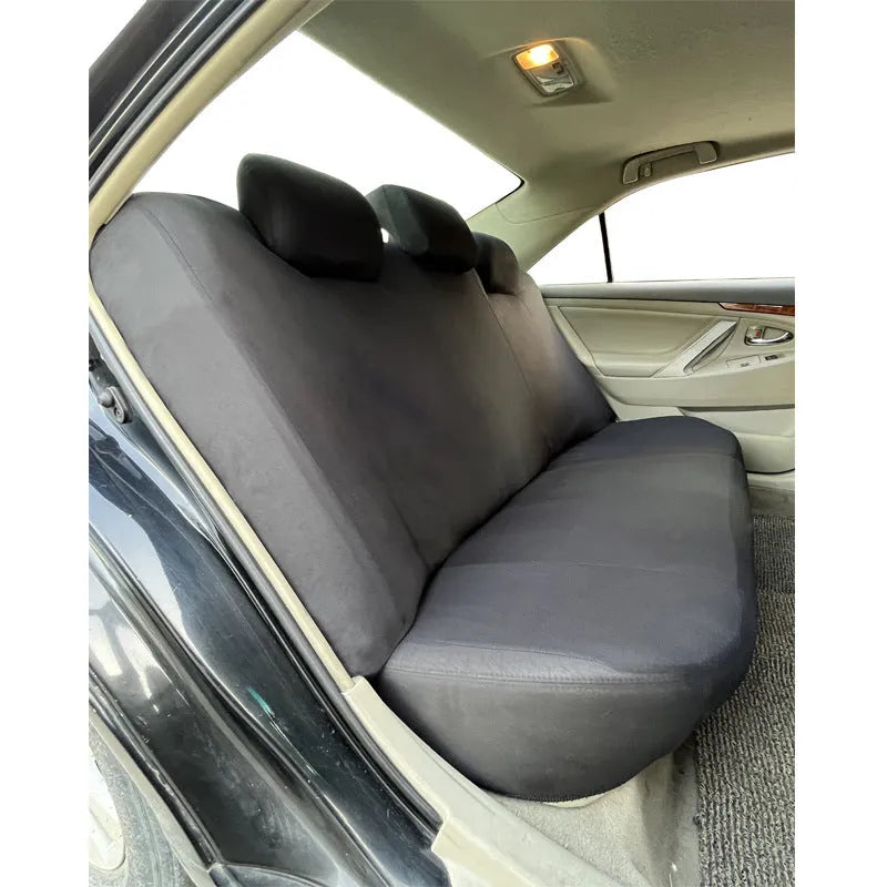 Polyester car seat cover with eyelet stitch detail in blue, red, black, or grey colour options.