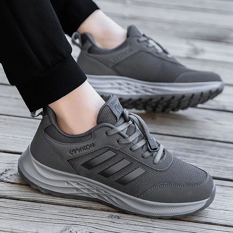 Breathable mesh casual shoes with elastic band closure in black, dark grey, purple and purplish red.