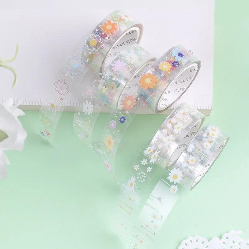 Five rolls of transparent decorative adhesive tape with Midsummer Daisy pattern, showing 1.5cm width