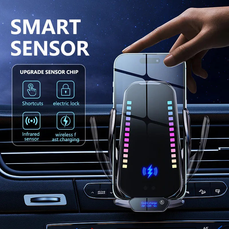 Silver car phone holder with wireless charging pad and electric clamp mounted on a car dashboard.