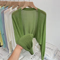 Women's hollow thin blouse with long lantern sleeves in linen-composition fabric, shown in apricot colour.