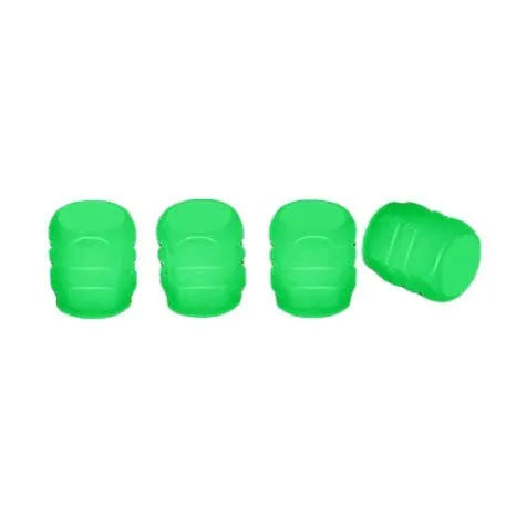Set of luminous green and blue rubber tyre valve caps on a tyre valve stem.
