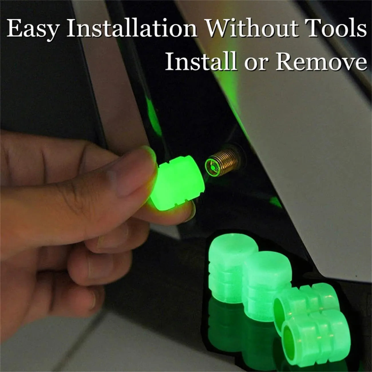 Set of luminous green and blue rubber tyre valve caps on a tyre valve stem.